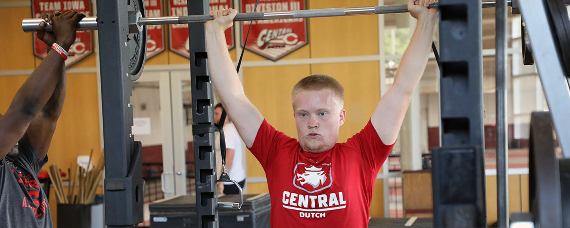 Central student lifting weights