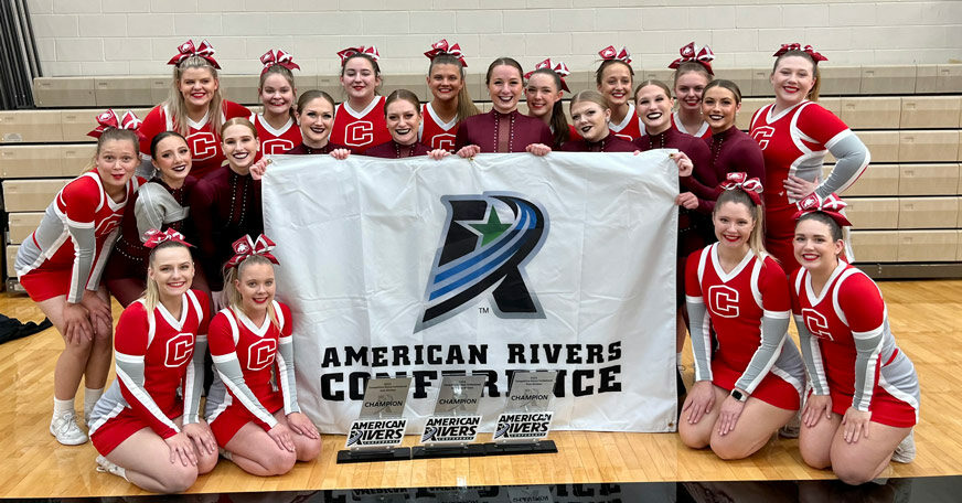 Members of the Central College Dance and Cheer teams pose for a photo with their trophies.