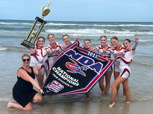 Central College dance team holding their trophy