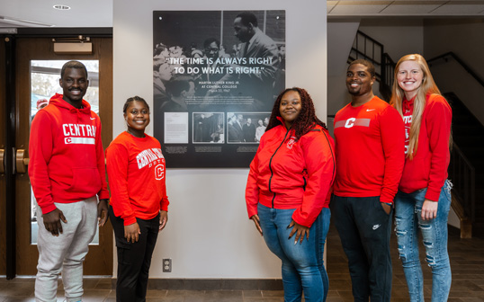 Central College students pose with the Martin Luther King Jr. display in Maytag Student Center.