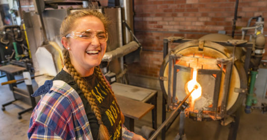 Allison Reinbold ’20 working in Central's glass blowing studio.