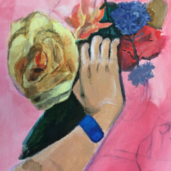 hand holding flowers with blue wrist band